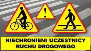 Zdjęcie przedstawia częściowo przejście dla pieszych a na nim znak ostrzegawczy, informujący o przejściu dla pieszych i rowerzystach
