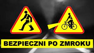 Znak ostrzegawczy pieszych i rowerzystów. Poniżej napis Bezpieczni po zmroku