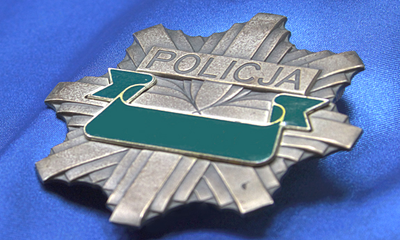 Ośmioramienna policyjna gwiazda na niebieskim tle