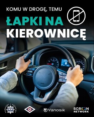 Kierownica, przekreślony telefon i napis komu w drogę temu łapki na kierownicę
