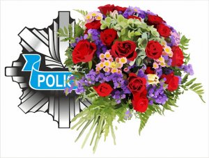 odznaka policyjna - i kwiaty